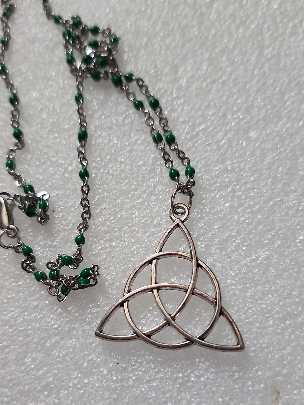 Hand Crafted Silver Trinity Knot Necklace with Green Accents